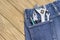 Adjustable wrench and other working tools in jeans pocket. Home repair tools for manual repair