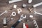 Adjustable wrench, plumbers tools and materials on the wooden background