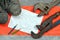 Adjustable wrenches with old boots and a sheet of paper with two pencils. Still life associated with repair, railway or plumbing