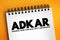 ADKAR - Awareness, Desire, Knowledge, Ability, Reinforcement acronym, business concept on notepad