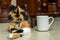 Admire the beauty and serenity of this cute cat as they take a well-deserved break, resting near a white blank mug
