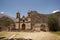 adobe church in an abandoned house, background texture image.Historic abandoned adobe wall cracked,dirty in ruins in a