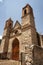 adobe church in an abandoned house, background texture image.Historic abandoned adobe wall cracked,dirty in ruins in a