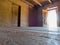 Adobe walls, wood floor and open door