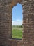 Adobe window in ruined building.