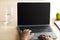 Adolescent black girl pupil typing on laptop with mockup empty screen and studying at home