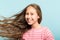 Adolescent girl wavy hair flying haircare kids