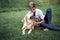 Adolescent male with labrador spend time on the grass