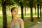 Adolescent portrait in park,happy teenager girl outdoor smiling, teen having fun on summer holidays,walking in nature