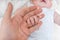 Adoption baby concept. Man holds little child\'s hand