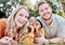 Adoption, mother and father in nature as a happy family relaxing on a picnic bonding in summer holidays. Interracial