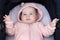 Adorable 4 Months Old Blue-Eyed Baby Girl Resting In Baby Stroller