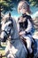 An adorable anime girl riding horse in a horse ranch, cute, anime style, 8k, wallpaper