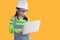 Adorable Asian girl acting in studio with construction helmet  girl with green color sweater dream to be architecture or engineer
