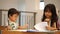 Adorable asian siblings learning at home together stock video