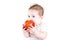 Adorable baby with big blue eyes eating red apple