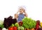 Adorable baby chef with healthy food vegetables and holding scoo