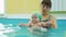 Adorable Baby Girl Enjoying Swimming in a Pool