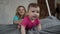 Adorable baby girl learning to crawl on bed