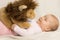 Adorable Baby Girl Playing With A Plush Lion Toy