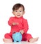 Adorable baby girl sitting with a blue piggy-bank