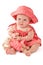 Adorable baby in pink dress plays with toy bunny