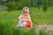 Adorable baby play with shovel and pail in sand