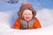 Adorable baby smile and digging hideout in snow