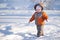 Adorable baby walk by lakes ice in park