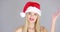 Adorable beautiful girl posing isolated in Santa Claus Hat