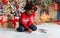 Adorable black little girl writing letter to Santa Claus