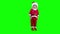 Adorable blond boy child put Santa hat on his head. Green chroma key background