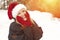 Adorable Blond Woman Wearing Santa Hat Outdoors in the Snow