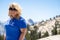 Adorable blonde woman poses at Olmstead Point in Yosemite National Park. Half dome blurred in background