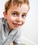 Adorable blue eyed boy with freckles and a missing tooth smile