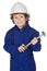 Adorable boy dressed worker in a hammer and a helmet