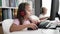 Adorable boy and girl students using computer and headphones studying at classroom