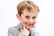 Adorable boy playing with a fake toothless smile, isolated portrait