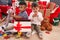 Adorable boys celebrating christmas unpacking gift at home