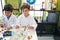 Adorable boys students playing with molecules toy at laboratory classroom