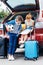 adorable brother and sister in trunk of car going