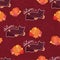 Adorable cartoon cat lay in fall leaves with pumpkin on dark curls background seamless pattern, halloween wrapping paper