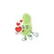 An adorable cartoon design of staphylococcus pneumoniae holding heart