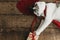 Adorable cat playing with red ribbon and gift box on rustic wood. Happy Valentines day. Love