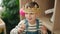 Adorable caucasian boy smiling confident holding king crown at kindergarten