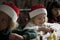 Adorable cheerful little girl wearing a santa hat