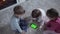 Adorable Cheerful Lucky Smart Joyful Toddler Children On Carpet Using Smartphone Green Screen Mobile Phone Hromakey
