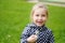 Adorable child with dandelion flower