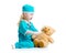 Adorable child dressed as doctor playing with toy