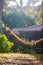 Adorable child lying in an orange hammock enjoying the sunshine of a Southeast Asian island